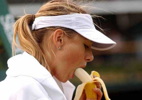 Eating a banana at a tennis match