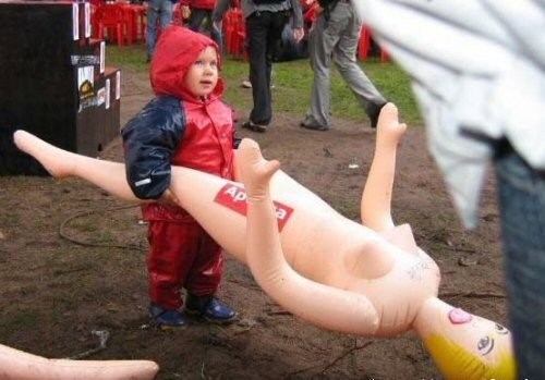 Little boy with a blow up doll