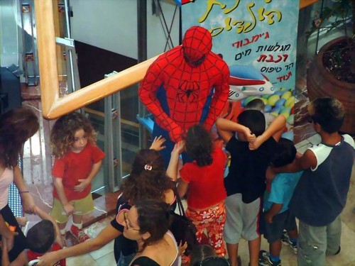 Oh my god, What is Spiderman doing to that kid?