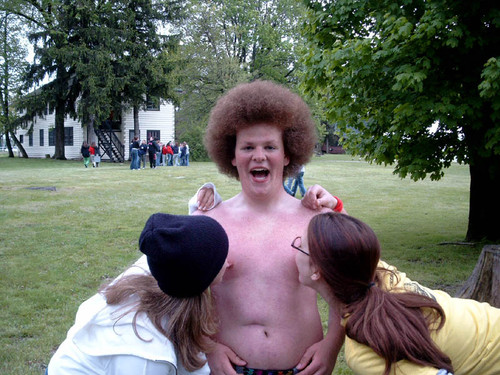 Believe it or not, this kid gets aroused somewhere else besides in his pants.  btw, check out that afro