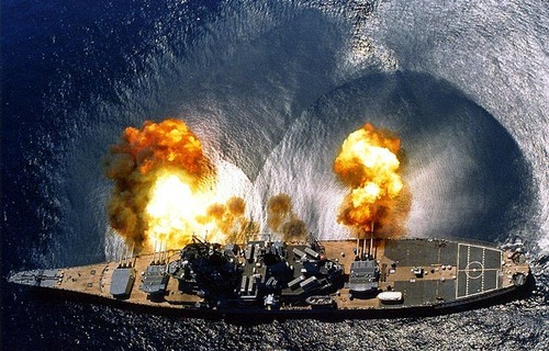 Really cool pic of a ship firing it's gigantic guns