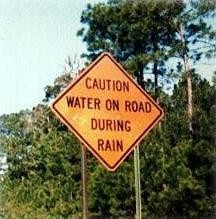 Water On Road Sign