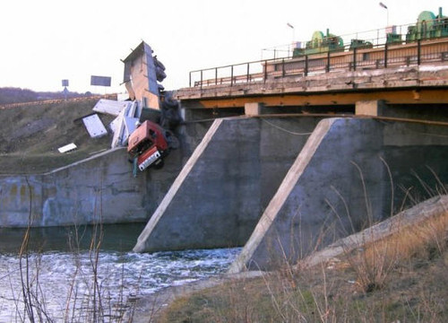 Truck flies off the side of the bridge