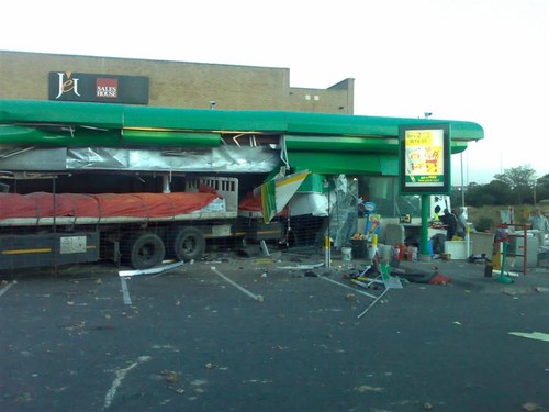 Truck smashes through convenience store