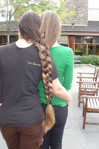 The best of friends braid their hair together