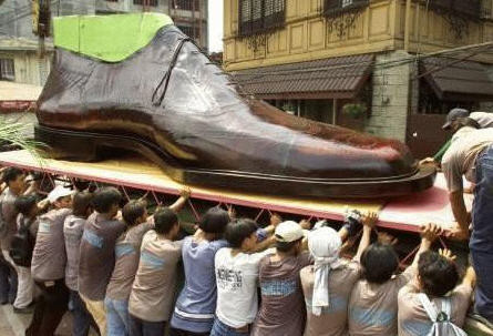 Carrying around the giant shoe