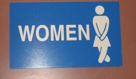 Women's room sign