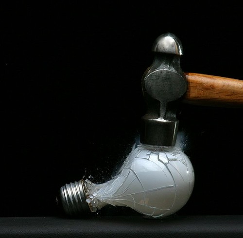 Slow motino of a light bulb hitting a hammer